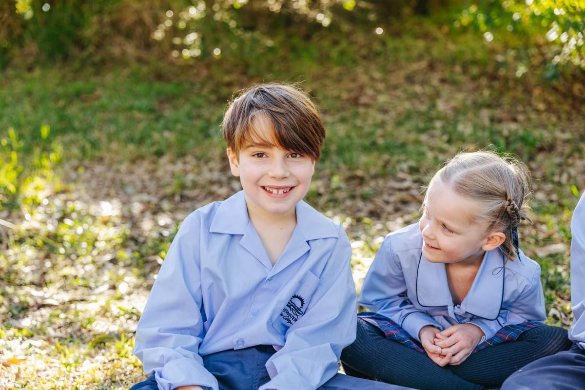 Students relaxing in the bushland grounds — book a tour of our campus near Morisset.